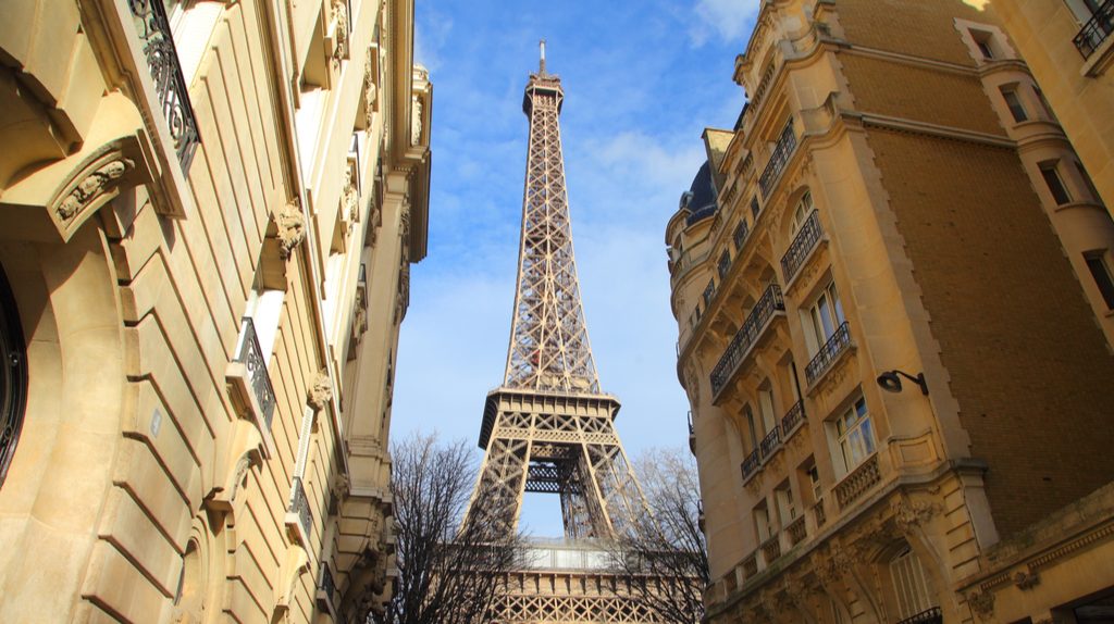 The Eiffel Tower amongst buildings.