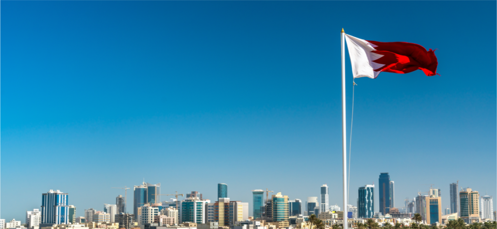 Bahrain flag over the city of Manama.